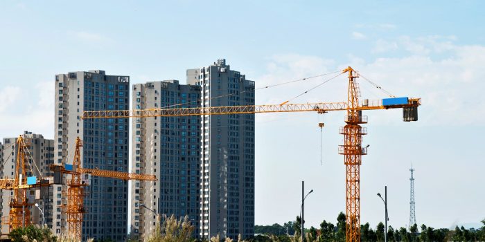 tower crane against a background of blocks of flats